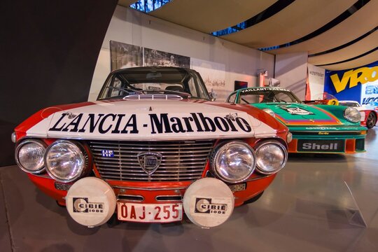 1969 -1970 Lancia Fulvia Sport 1000 Barchetta rally car. Autoworld, Brussels, Belgium. Front view. Headlights, front grille and hood.