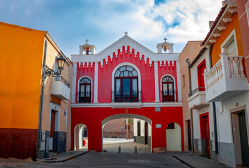 Red facade of the Hermitage of Our Lady of Monserrate, Orihuela, Alicante, Spain