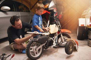 Family, child and fixing bike in garage at home for teamwork, support and repair with tools....
