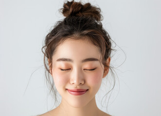 beautiful Korean woman with a beautiful face, eyes closed and smiling