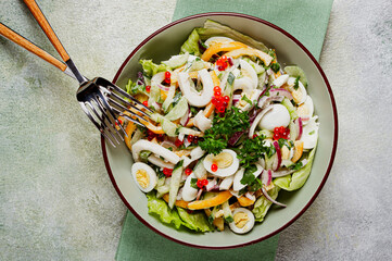salad with squid, fresh cucumber, eggs, sweet pepper, red onion, with dressing, homemade, no people,