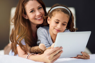 Portrait, tablet and mother with girl on bed at home watch online video on app, internet or social...