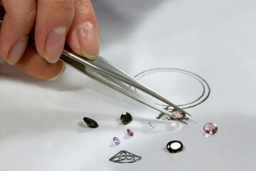 The work of a jeweler designer. A jewelry designer develops sketches of jewelry. Design studio....