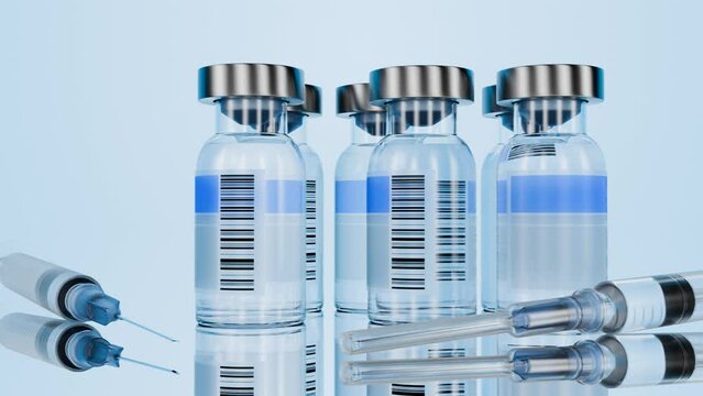 Vaccination concept. Bottles with the drug for medical purposes. Antibiotics. Camera movement along glass bottles with medicine. Glass bottle with a barcode label and medicine inside and a disposable 