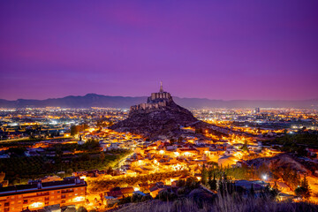 Panoramic pre-dawn view of the Murcia orchard, with the medieval castle of Monteagudo, Murcia,...