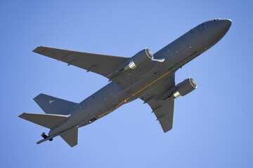 Side view of a KC-46 Pegasus  tanker aircraft with boom extended © ranchorunner