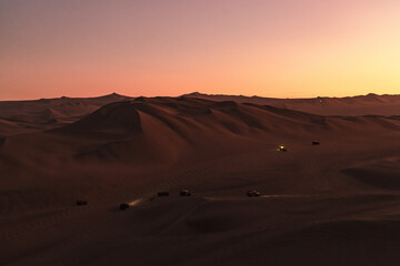Fototapeta na wymiar sunset over the dunes around huacachina in the Peruvian desert