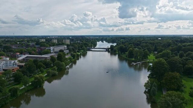 An aerial drone view of Aasee Lake in M&uuml;nster . Lake Aasee is an artificial lake located in M&uuml;nster , Germany .