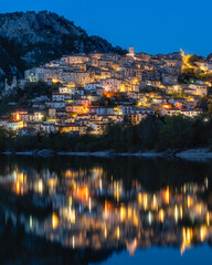 Panoramic evening view of Barrea and its lake, province of L'Aquila in the Abruzzo region of Italy. - 790249674