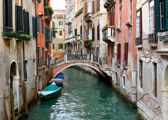 Narrow canal with bridge in Venice, Italy. Architecture and landmark of Venice. Cozy cityscape of Venice. - 790256488
