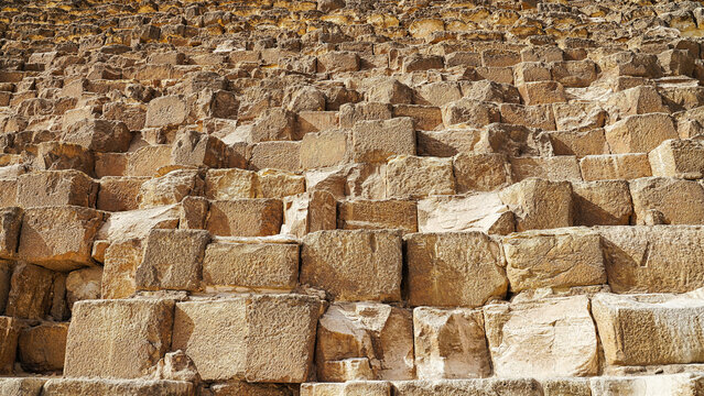 Close up of the Gigantic base rocks of the Great Pyramid of Khufu on Giza plateau made of tura limestone with each block weighing a ton 