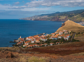 View of Quinta do Lorde Resort Hotel Marina and Canical, East coast of Madeira Island, Portugal. Scenic volcanic landscape of Atlantic Ocean with luxury resort buildings and town in background - 790260844