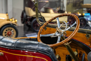 Vintage car wood and leather interior from the early 20th century.