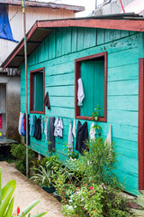 Washing line and colorful house in El Castillo village along the San Juan river in Nicaragua
