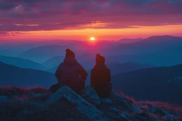 Foto op Canvas A photograph of a couple watching the sunset from a mountain peak, their silhouette framed against t © Oleksandr