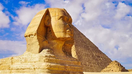 Foto op Canvas Close up view of the face of the Great Sphinx of Giza,said to resemble Pharaoh Khafre with its damaged nose on a bright sunny day on the Giza plateau  © InnerPeace