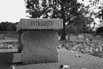 Integrity Stone Bench At a Park in Black & White