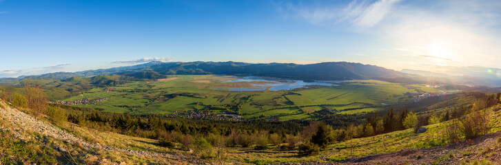 A panorama of the Cerkinško jezero lake. A large panoramic view of a lake in Slovenia.