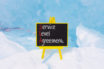SLA service level agreement symbol. Concept words SLA service level agreement on beautiful yellow...