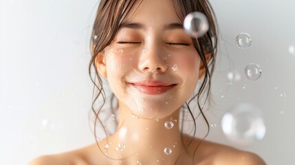 A woman displays a radiant smile with soap covering her face, embodying a moment of blissful relaxation and care for her skin.