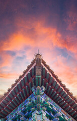 Low angle of the traditional Chinese building ridge corner with fire clouds, background