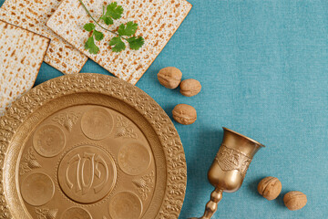 Golden plate for Seder Pesach (Jewish Passover holiday) (with the inscriptions: egg, shankbone, bitter herbs, lettuce, charoset, parsley) Concept (jewish Passover holiday)