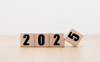 Wooden block with numbers 2025 on wooden table with white background, New Year 2025