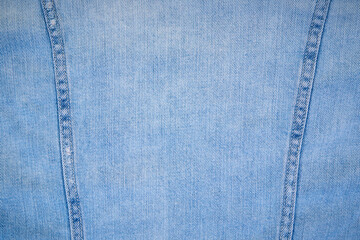 Light jeans background with seam.