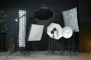 Set of studio lighting equipment with soft boxes in photo studio