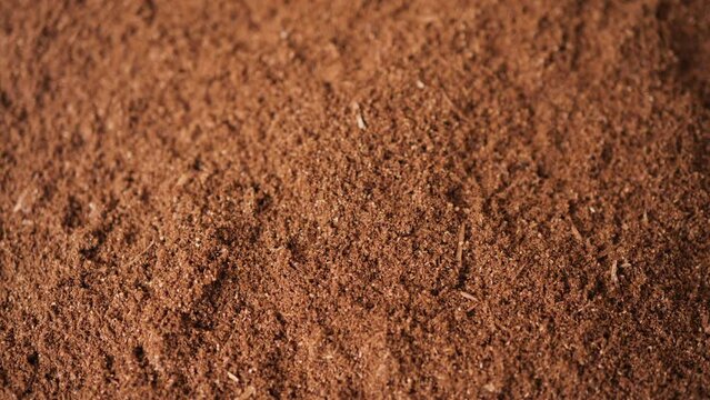 Mixing soil for growing mushrooms.