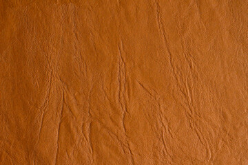 Brown, real leather background with wrinkles