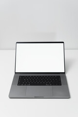 macbook laptop with white screen on a white table with white background, laptop screen mocap