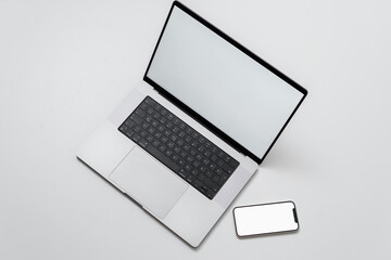 macbook laptop with white screen on a white table with white background, laptop screen mocap with...