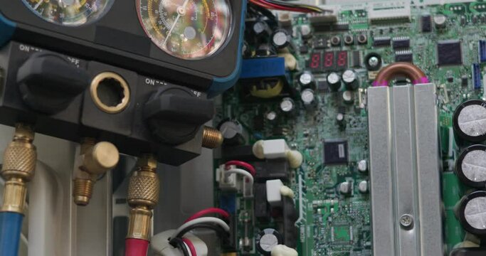 Air conditioner technician hand check condenser circuit by amp clamp meter,Air conditioner maintenance service, Home service concept