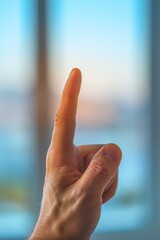 A man holding up his finger in front of a window, AI