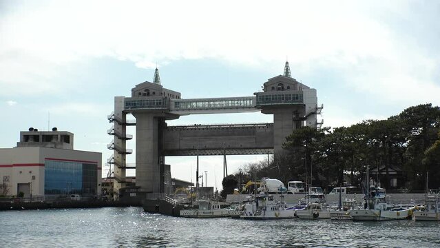 NUMAZU, SHIZUOKA, JAPAN - MARCH 2024 : View of VIEW-O flood gate at Numazu Port. Gigantic gate designed to protect the city from tsunami. One of the largest water gates in Japan.