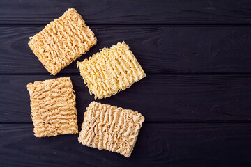 Dry yellow instant noodles . Asian Fast food background