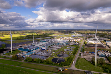 Wind turbines, water treatment and bio energy facility and solar panels in The Netherlands part of...