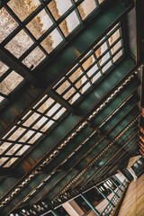 Fototapeta premium Old rusty and weathered metal covered walkway