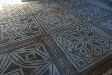 Floor with mosaic inside a ancient roman building at the ruins of Pompeii, Campania, Italy