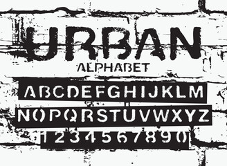 set of letters and numbers of the latin alphabet. Font urban stencil with in grunge style ander brick wall background - 790395630