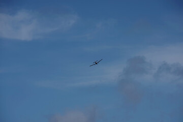 Single engine airplane high in the sky