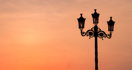 Background image of retro lamp in sunset.