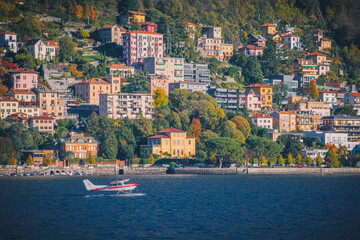 Small airplane landing on the Como lake, Como, Italy