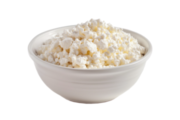 A bowl full of fresh white cottage cheese isolated on a white background.