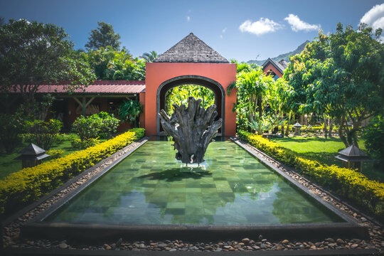 Water pool with sculpture in the inner garden of Rumerie de Chamarel, Mauritius