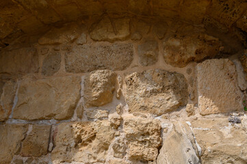 Part of the ancient stone wall, background, archaelogical site 1