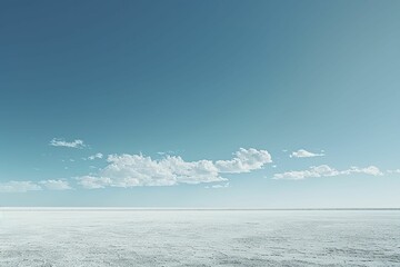 The stark white salt flats stretched endlessly beneath the vast, cerulean sky, embodying minimalist beauty.