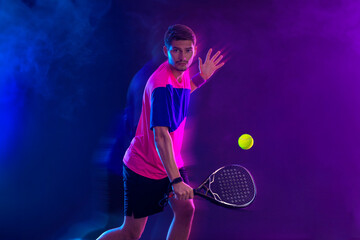 Padel Tennis Player with Racket in Hand. Paddle tenis, on a blue background. Download in high resolution. - 790413087