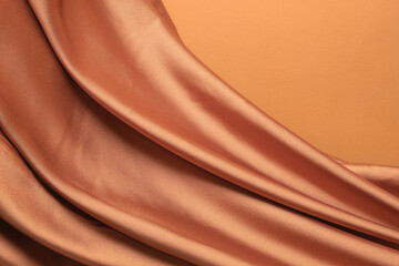 Smooth elegant golden satin texture can use as abstract background. Luxurious background design